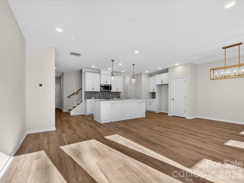 This bright and airy kitchen features an oversized kitchen Island. 42' kitchen cabinets with soft close doors & drawers. Solid shelving in the pantry. Stainless steel Frigidaire appliances with cooking vented to the outside. This bright and airy kitchen features an oversized kitchen Island. 42' kitchen cabinets with soft close doors & drawers. Solid shelving in the pantry. Stainless steel Frigidaire appliances with cooking vented to the outside.