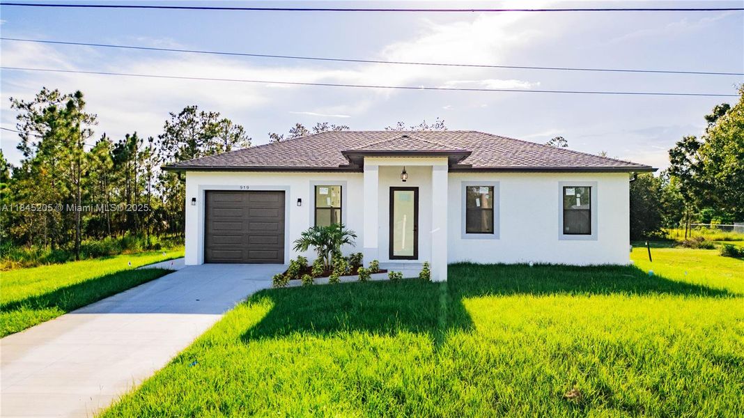 Front exterior of a new home in , Lehigh Acres, FL, highlighting curb appeal (Image 16). Front exterior of a new home in , Lehigh Acres, FL, highlighting curb appeal (Image 16).