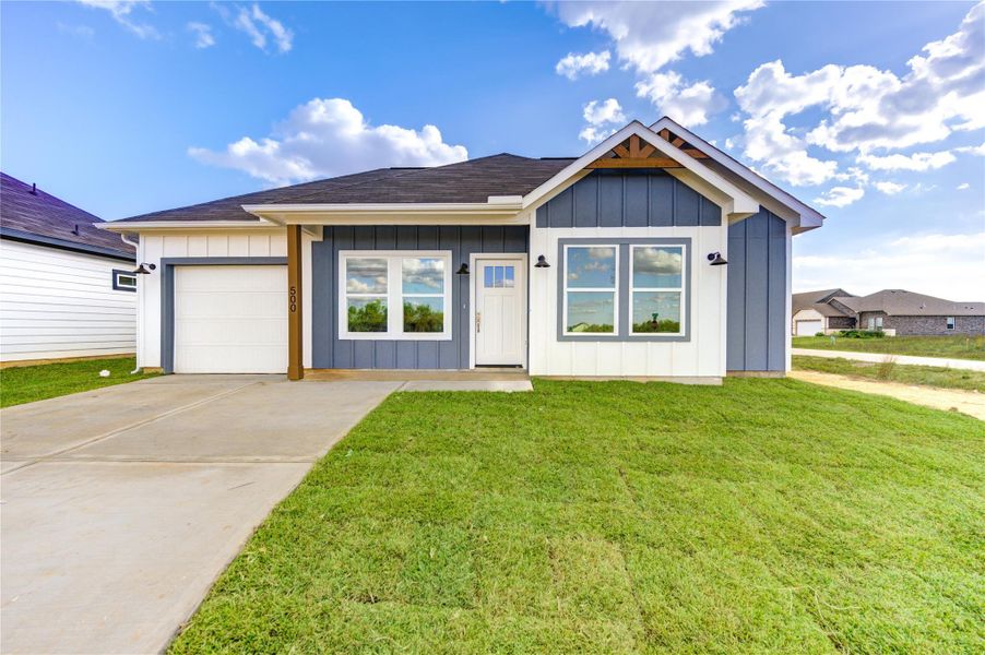 Front exterior of a new home in , Cleveland, TX, highlighting curb appeal (Image 1).