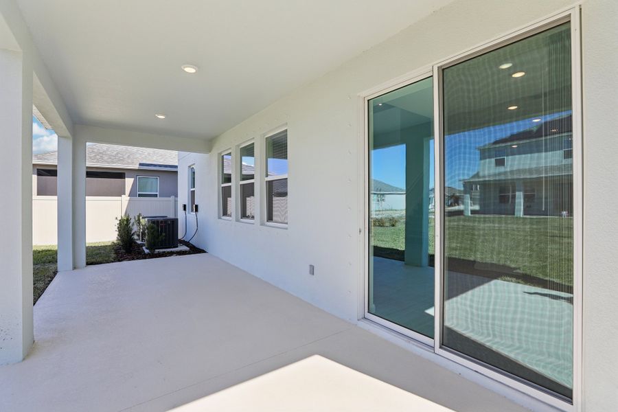 Exterior details and patio area of a home in St. Johns Preserve, Palm Bay (Image 2).