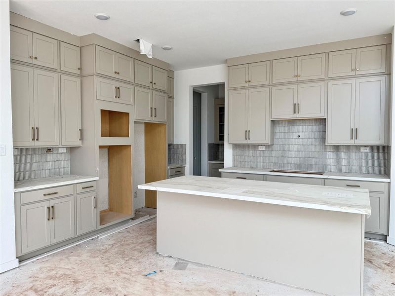 Island kitchen - light gray stacked cabinet for extra storage