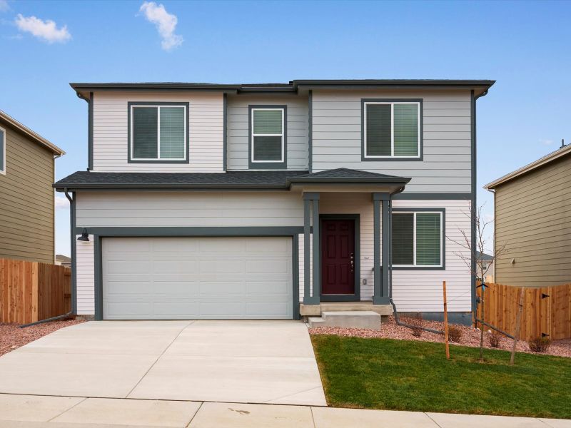 Front exterior of a new home in Lorson Ranch : The Springs Collection, Colorado Springs, CO, highlighting curb appeal (Image 1).