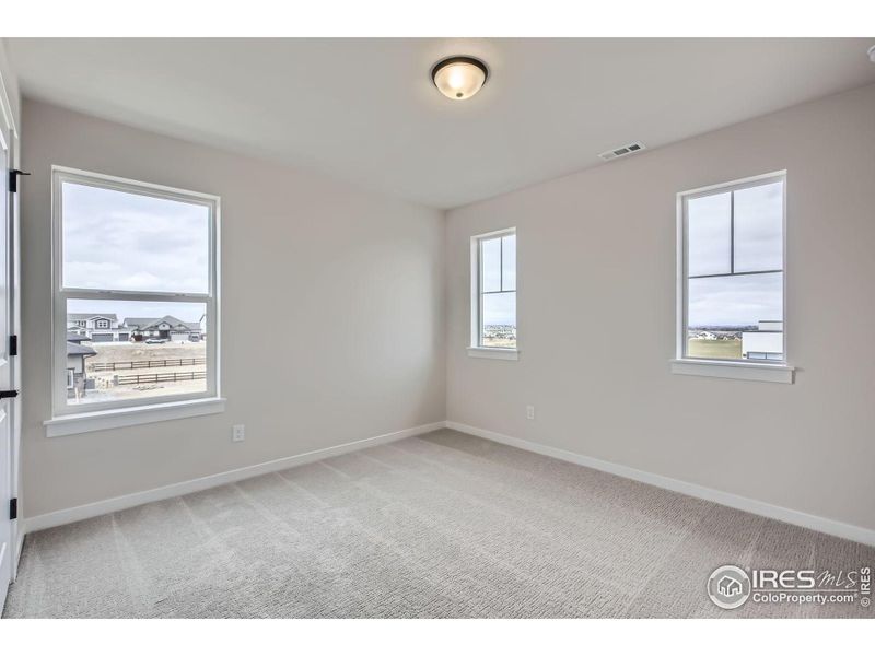 Spacious, unfurnished interior of a new home in RainDance National 60/70, Windsor (Image 16).