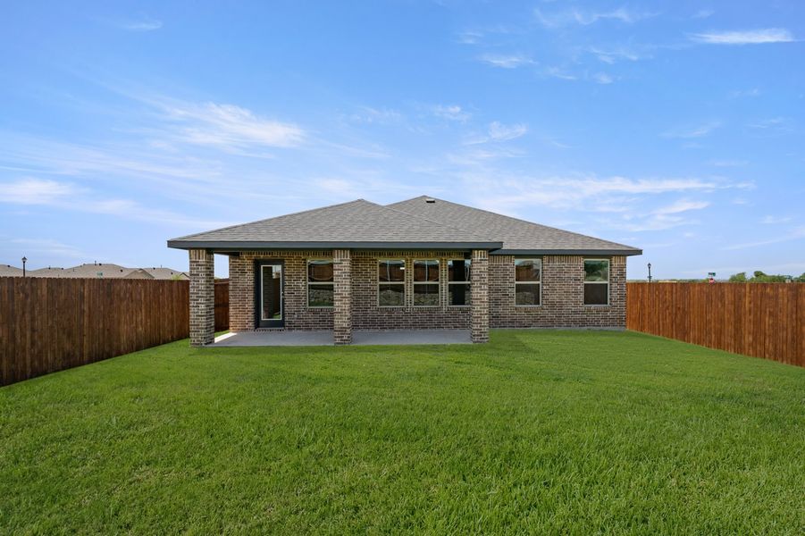 Front exterior of a new home in Baker Farms, Cleburne, TX, highlighting curb appeal (Image 26). Front exterior of a new home in Baker Farms, Cleburne, TX, highlighting curb appeal (Image 26).