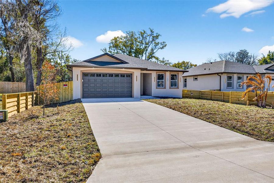 Front exterior of a new home in , Masaryktown, FL, highlighting curb appeal (Image 26).