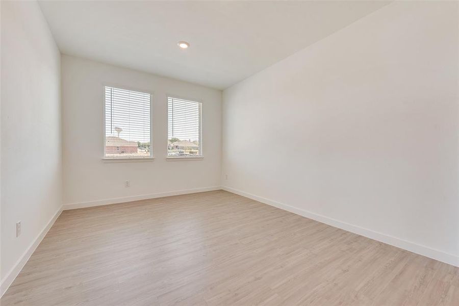 Unfurnished room with light hardwood / wood-style floors