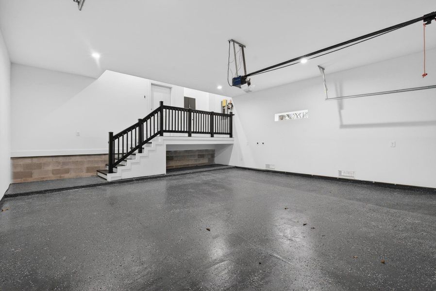 Garage epoxy Floor and connection for car charger ready 60Amp and 50Amp. Comes with garage door opener