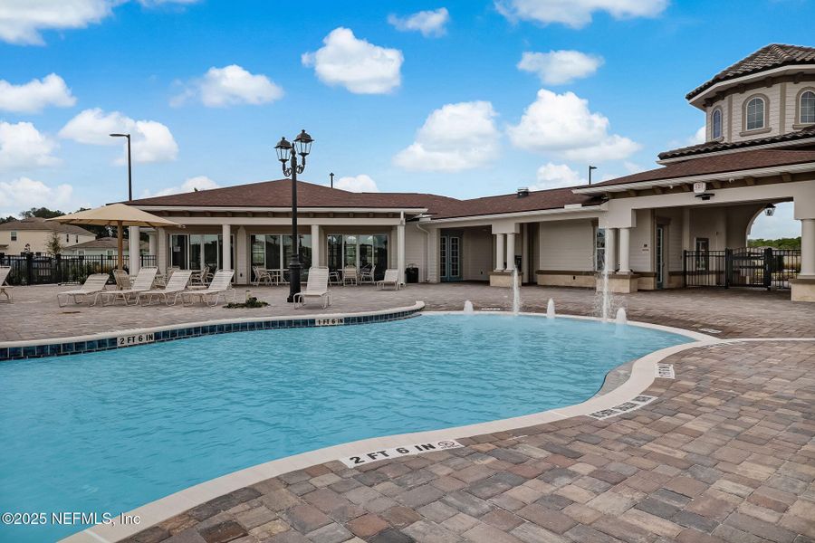 Front exterior of a new home in Dorado at Entrada, St. Augustine, FL, highlighting curb appeal (Image 24).