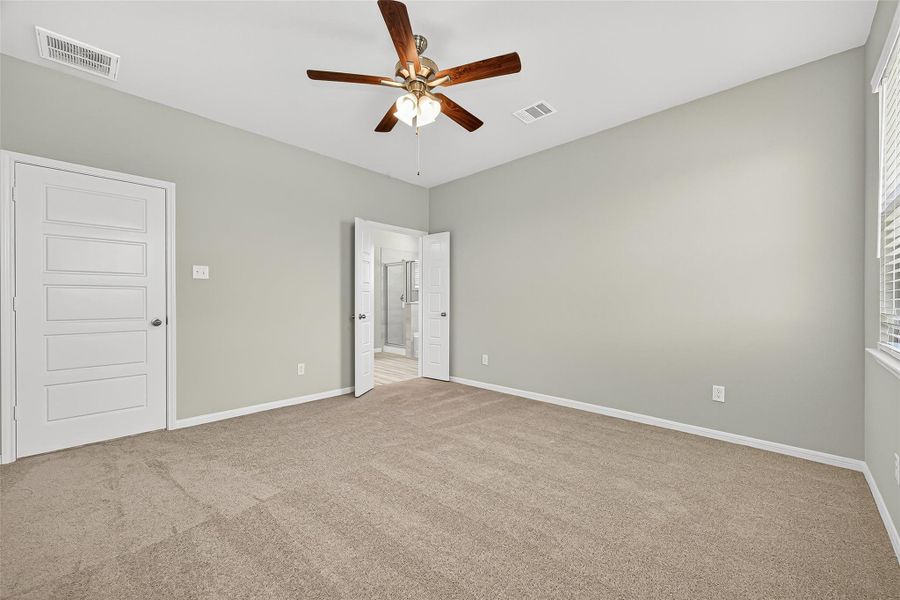 Spacious, unfurnished interior of a new home in Sunterra, Katy (Image 40).