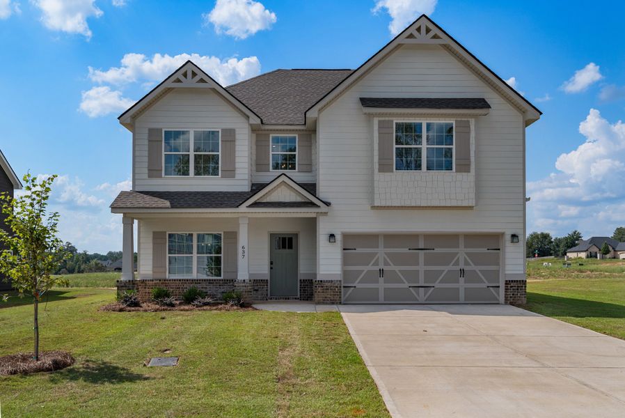 Representative exterior photo of a completed home built from the Delilah by Hughston Homes in Juliette Crossing, Forsyth, GA (Image 12).