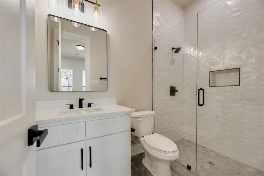 Full bath featuring vanity and a shower stall