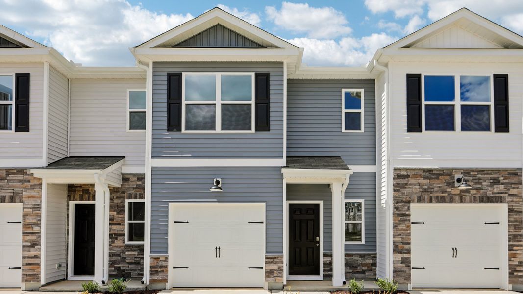 Front exterior of a new home in The Townes at Martin Farms, Aberdeen, NC, highlighting curb appeal (Image 1). Front exterior of a new home in The Townes at Martin Farms, Aberdeen, NC, highlighting curb appeal (Image 1).
