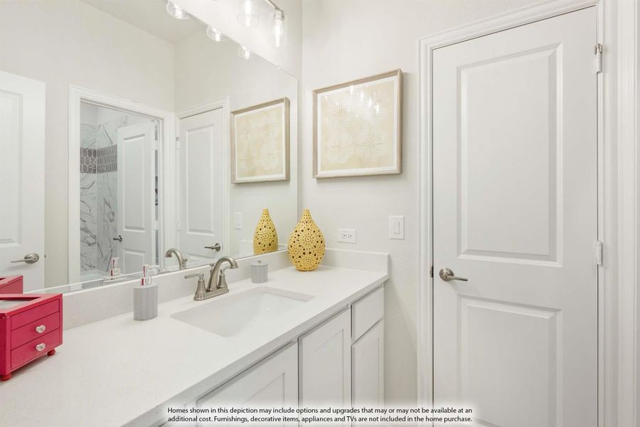 Bathroom with white vanity, single sink, large mirror, and walk-in shower visible in reflection