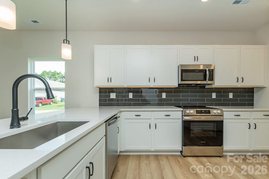 Furnished interior view inside a new home in Country Club Village, Salisbury (Image 7).