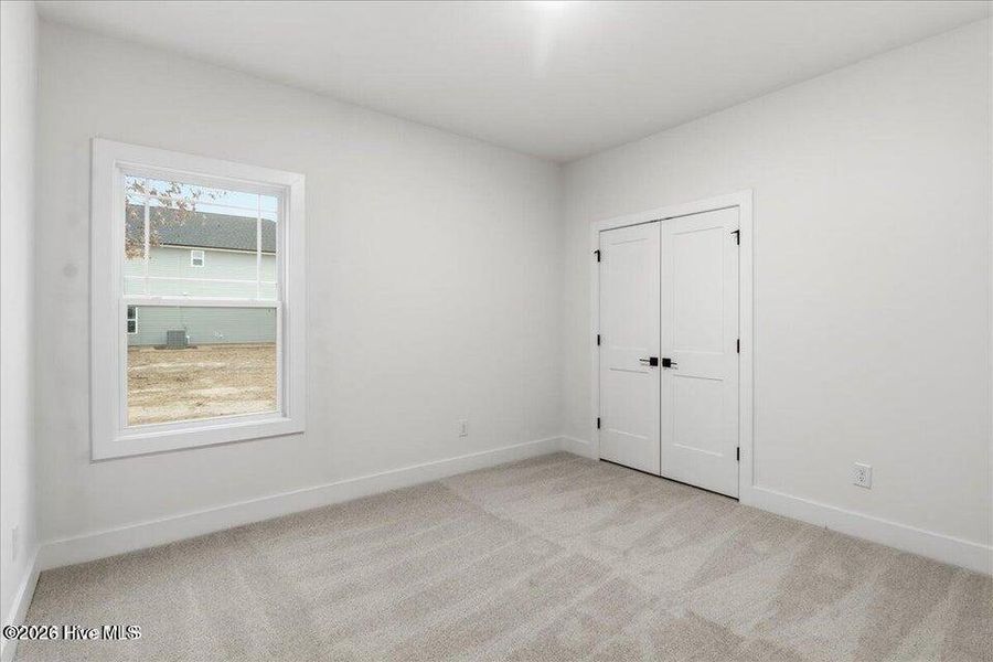 Spacious, unfurnished interior of a new home in Wood Creek Landing, Leland (Image 27).