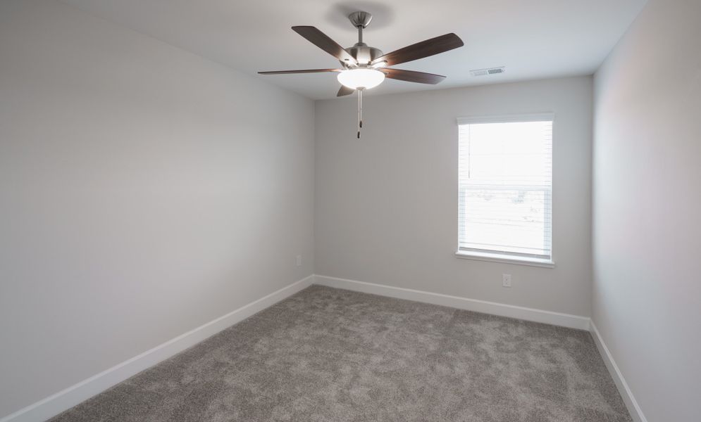 Representative unfurnished interior of a home built from the The Holland by Cothran Homes in Holly Ridge, Greenville (Image 39).