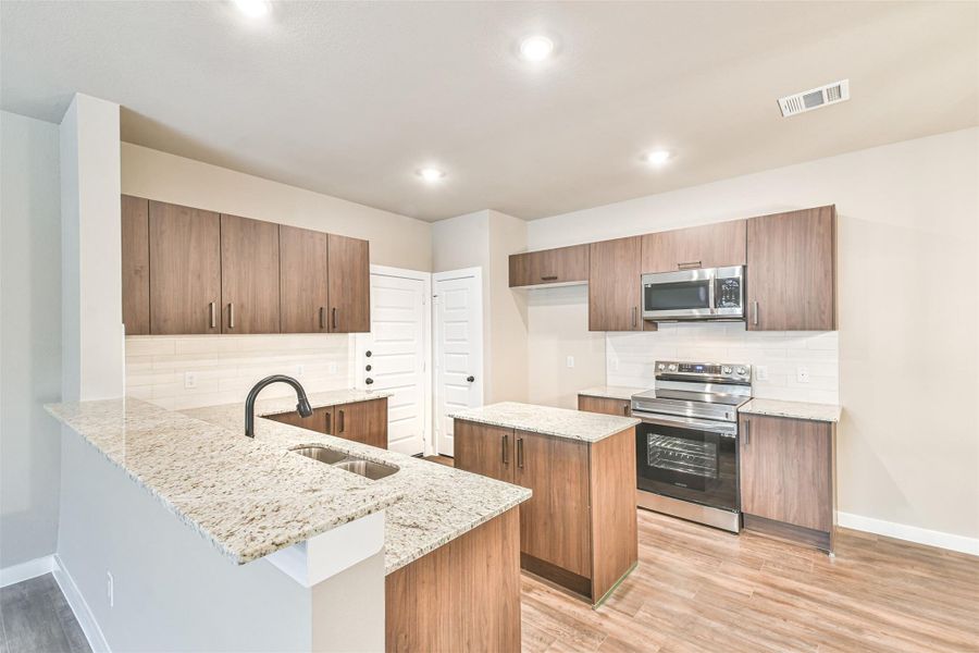 Furnished interior view inside a new home in Enclave At Dobbin, Magnolia (Image 4).