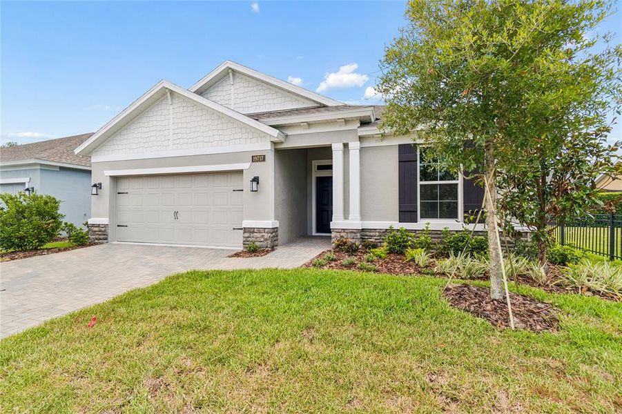 Front exterior of a new home in Cascades at Southern Hills, Brooksville, FL, highlighting curb appeal (Image 26).