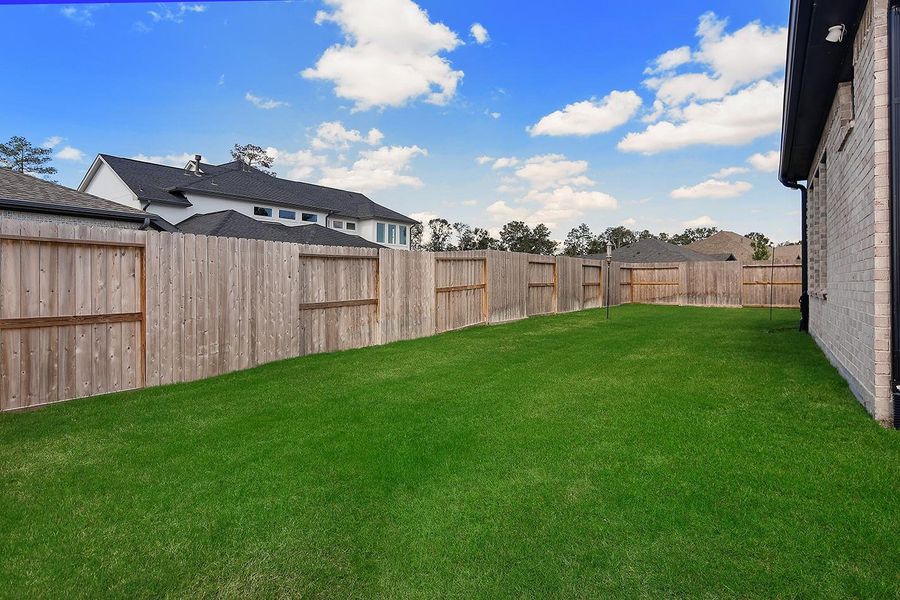 Exterior details and patio area of a home in The Highlands - 65', Porter (Image 21). Exterior details and patio area of a home in The Highlands - 65', Porter (Image 21).