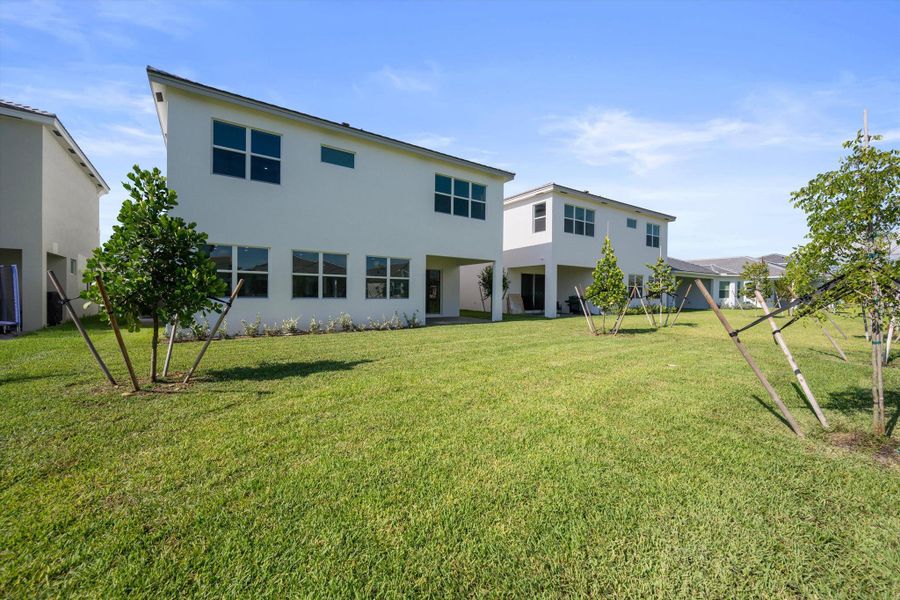 Front exterior of a new home in , Westlake, FL, highlighting curb appeal (Image 26). Front exterior of a new home in , Westlake, FL, highlighting curb appeal (Image 26).
