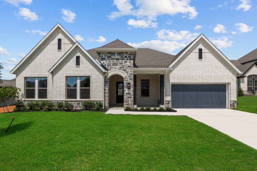 Representative exterior photo of a completed home built from the The Jaiden by David Weekley Homes in Monterra - Classics, Fate, TX (Image 1).