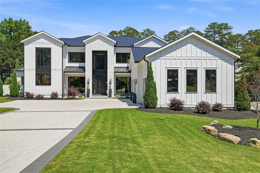 Front exterior of a new home in , Roswell, GA, highlighting curb appeal (Image 24). Front exterior of a new home in , Roswell, GA, highlighting curb appeal (Image 24).