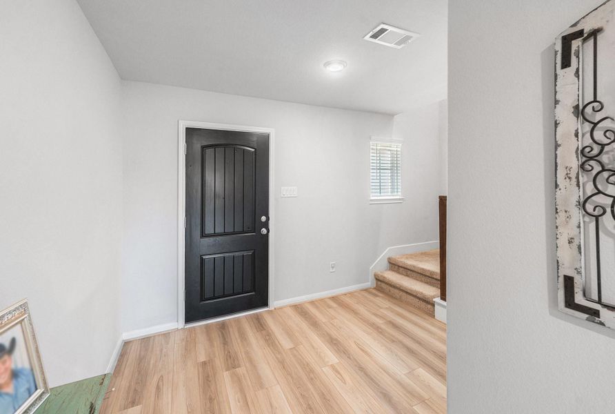 Walking back toward the front door, you'll see the stairwell going to the upstairs gameroom and 3 bedrooms. Walking back toward the front door, you'll see the stairwell going to the upstairs gameroom and 3 bedrooms.