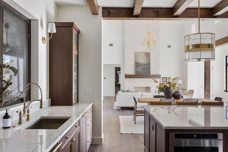 Luxury kitchen looking into dining area and living space