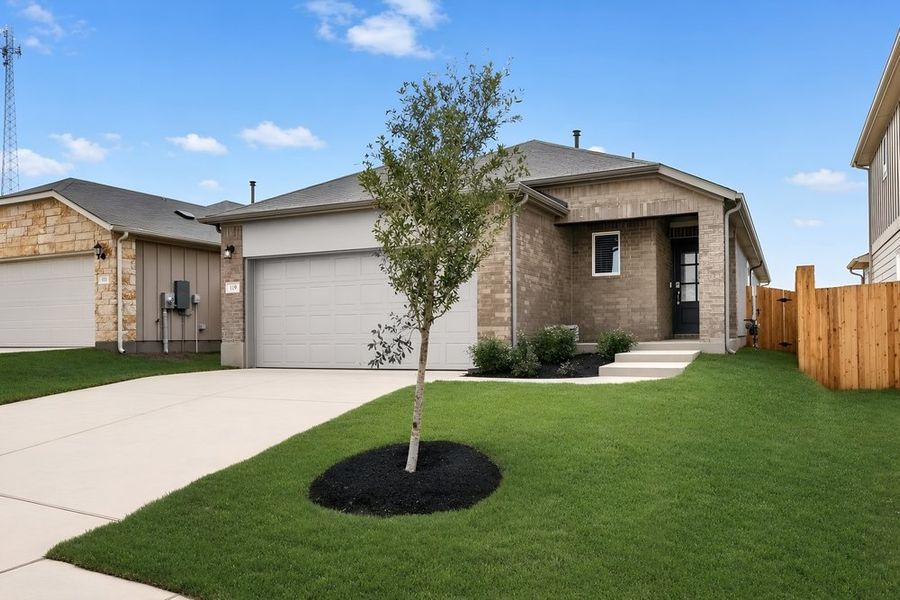 Front exterior of a new home in Sunfield, Buda, TX, highlighting curb appeal (Image 1). Front exterior of a new home in Sunfield, Buda, TX, highlighting curb appeal (Image 1).