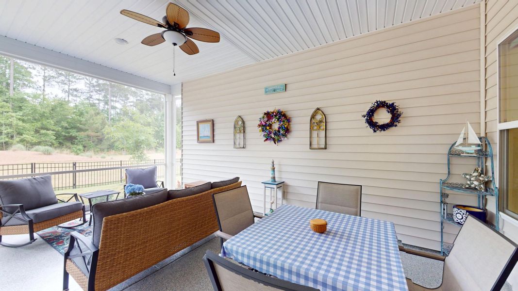 Exterior details and patio area of a home in Summerwind Crossing at Lakes of Cane Bay, Summerville (Image 4).