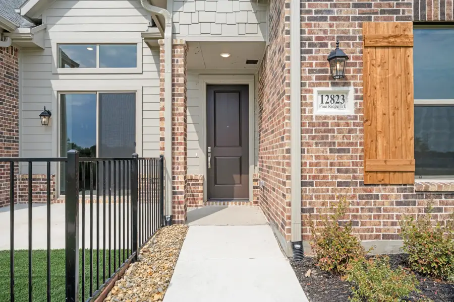 Exterior details and patio area of a home in Cottonwood Creek, Rowlett (Image 31).