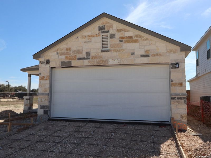 Front exterior of a new home in Winding Brook, San Antonio, TX, highlighting curb appeal (Image 18).