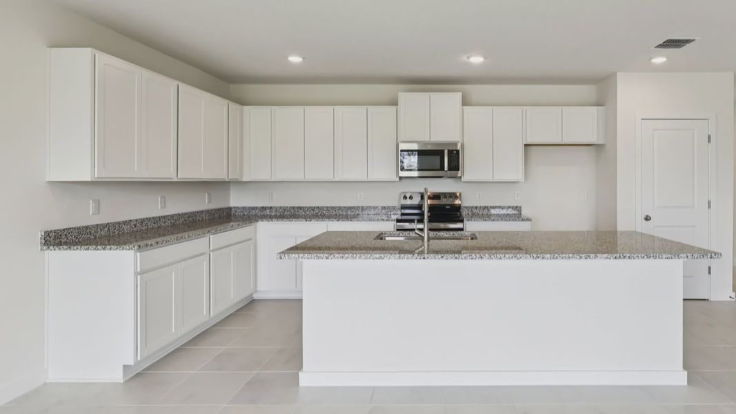Kitchen of the Baker Floor Plan by DRB Homes in Liberty Trace New Homes in Haines City