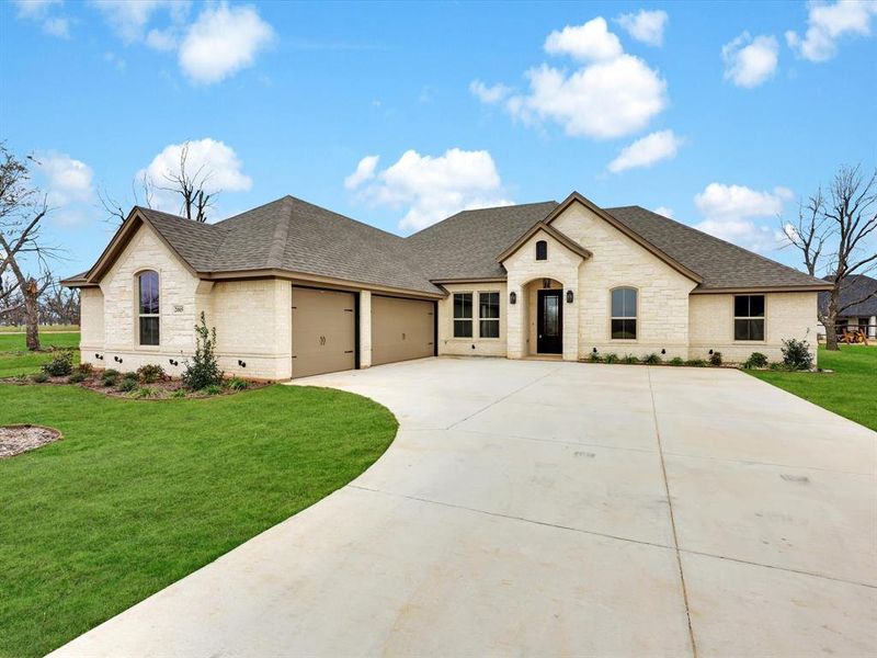 Front exterior of a new home in , Granbury, TX, highlighting curb appeal (Image 1).