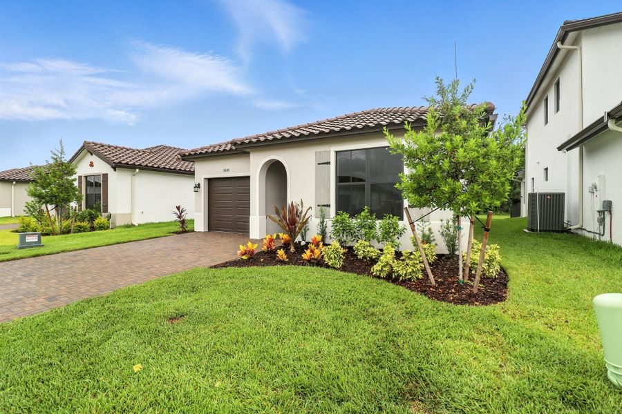 Front exterior of a home in the Maple Ridge community, located in Ave Maria, FL (Image 10). Front exterior of a home in the Maple Ridge community, located in Ave Maria, FL (Image 10).