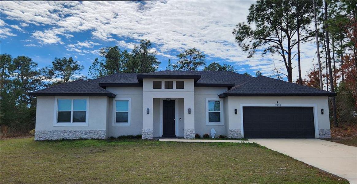 Front exterior of a new home in , Ocala, FL, highlighting curb appeal (Image 27).