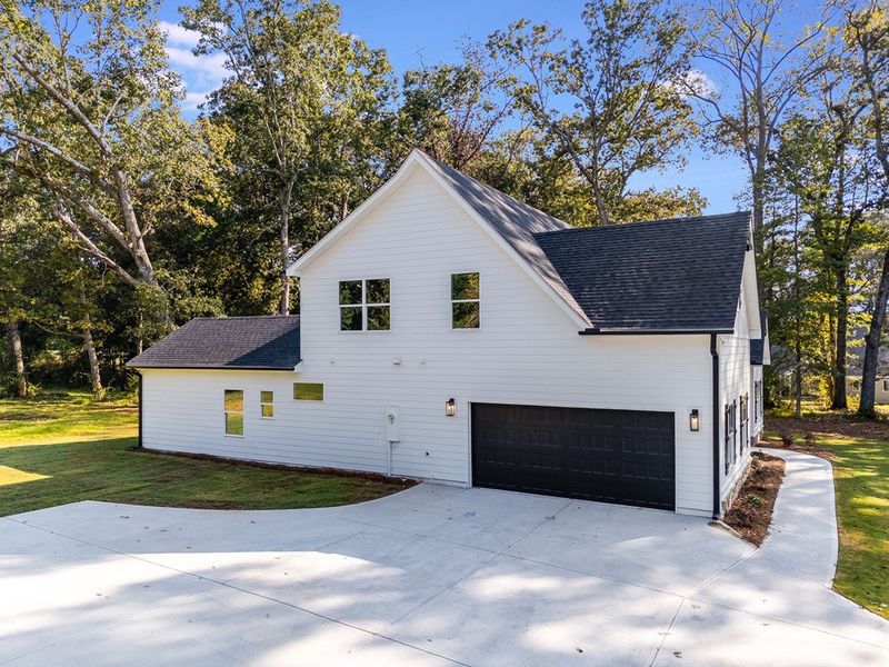 Front exterior of a new home in LOVVORN ESTATES, Carrollton, GA, highlighting curb appeal (Image 28).