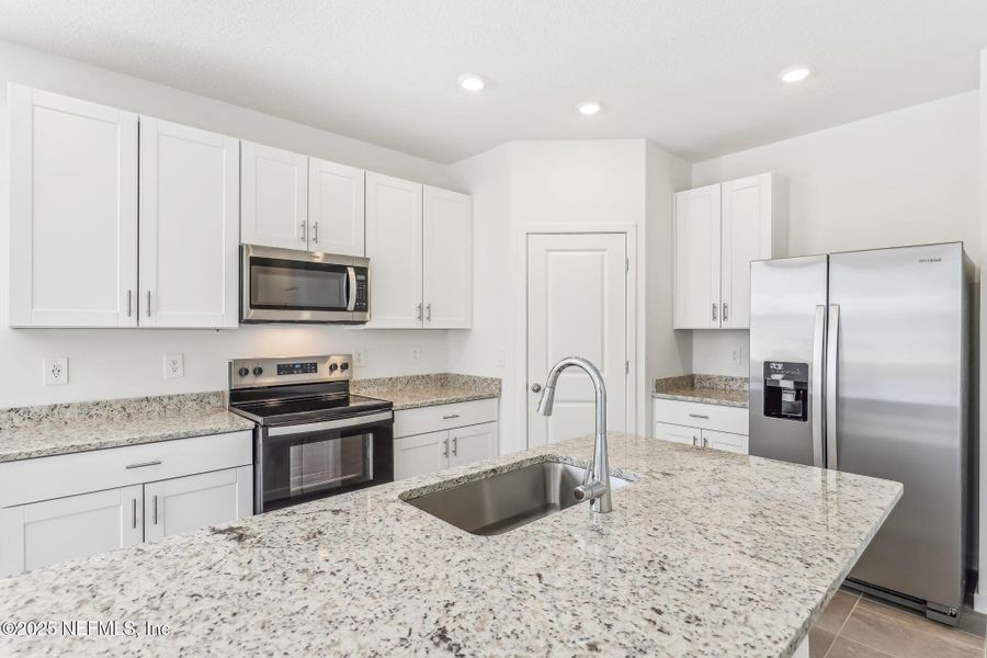 Furnished interior view inside a new home in Lakes at Bella Lago - Signature Series, Green Cove Springs (Image 6). Furnished interior view inside a new home in Lakes at Bella Lago - Signature Series, Green Cove Springs (Image 6).