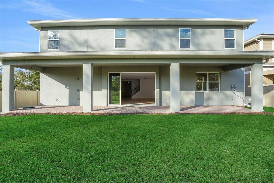 Exterior details and patio area of a home in Palms at Windermere, Windermere (Image 25).