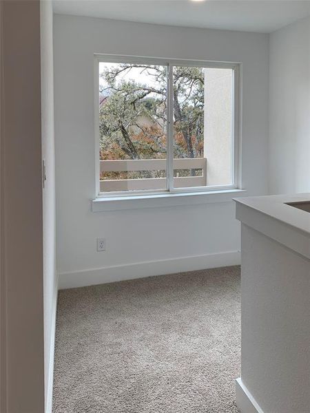 Spare area next Master Bedroom. Can be used as an office/reading nook/gym area