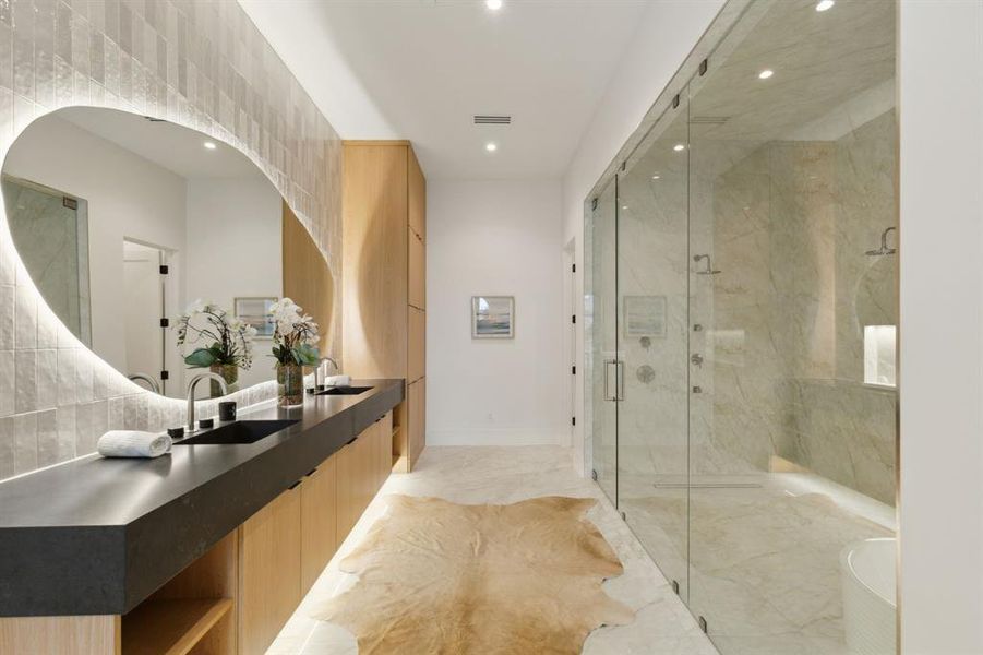 Spacious Bath oasis with designer mirrors and lighting, built-in cabinetry, lighting under cabinetry, duel shower, Hollywood soaking tub, and tile floors Spacious Bath oasis with designer mirrors and lighting, built-in cabinetry, lighting under cabinetry, duel shower, Hollywood soaking tub, and tile floors