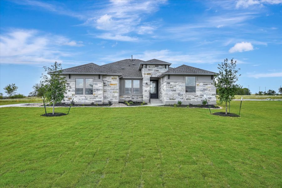 Representative exterior photo of a completed home built from the Bandera II by Giddens Homes in Whispering Wind, Bertram, TX (Image 28).