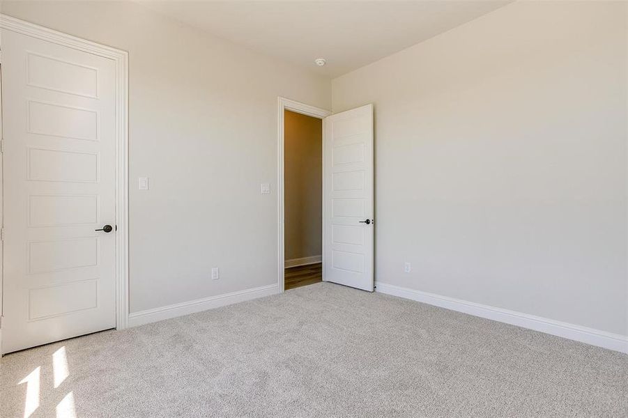 Unfurnished bedroom featuring carpet