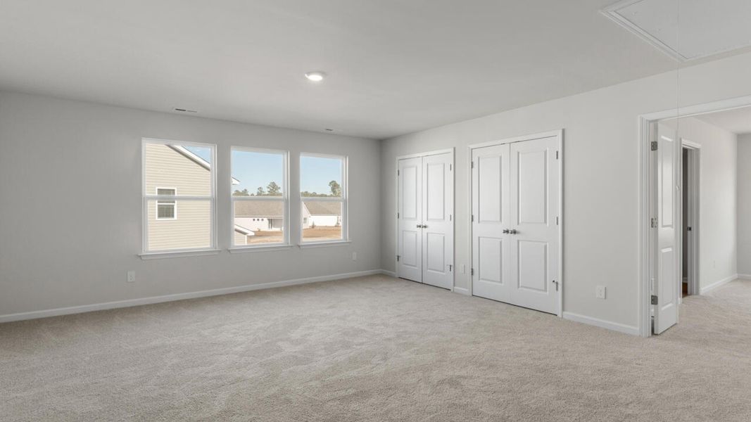 Spacious, unfurnished interior of a new home in Indigo Preserve, Leland (Image 30).
