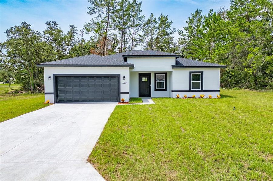 Front exterior of a new home in , Ocala, FL, highlighting curb appeal (Image 19).