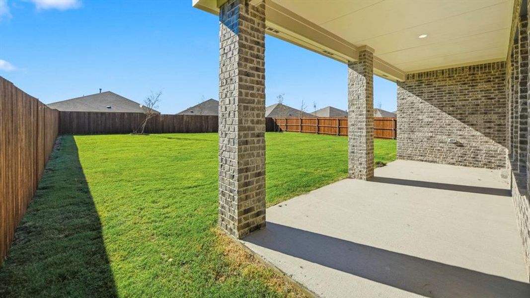 Fenced backyard featuring a patio area