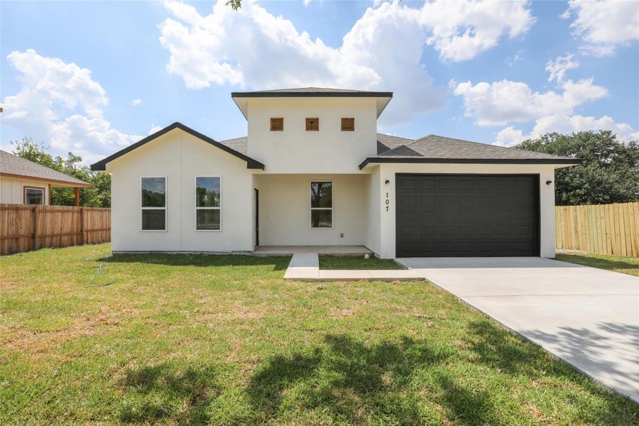 Front exterior of a new home in , Bastrop, TX, highlighting curb appeal (Image 1). Front exterior of a new home in , Bastrop, TX, highlighting curb appeal (Image 1).