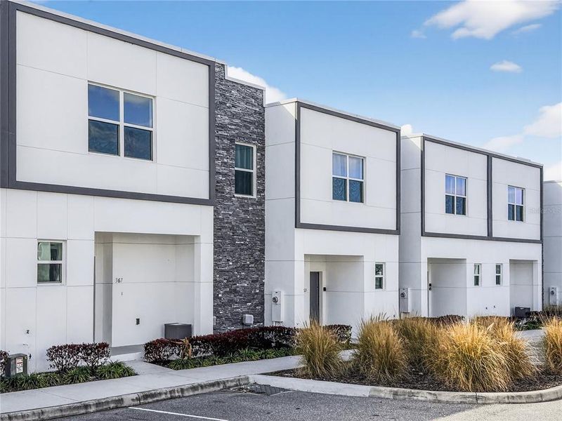 Front exterior of a new home in , Davenport, FL, highlighting curb appeal (Image 29).