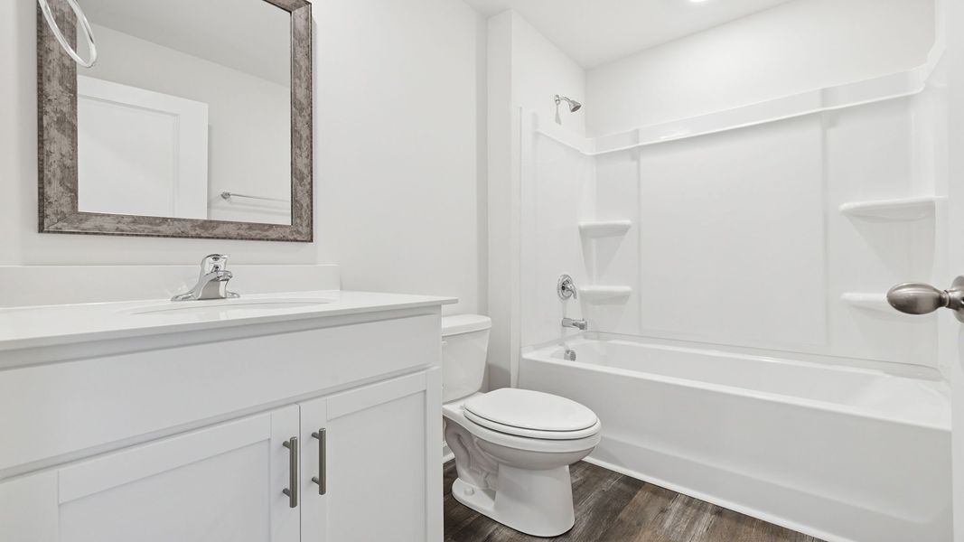 Furnished interior view inside a new home in Bentley Park, Greenwood (Image 4).