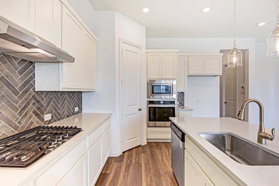 Brown Townhome Kitchen by Ashton Woods